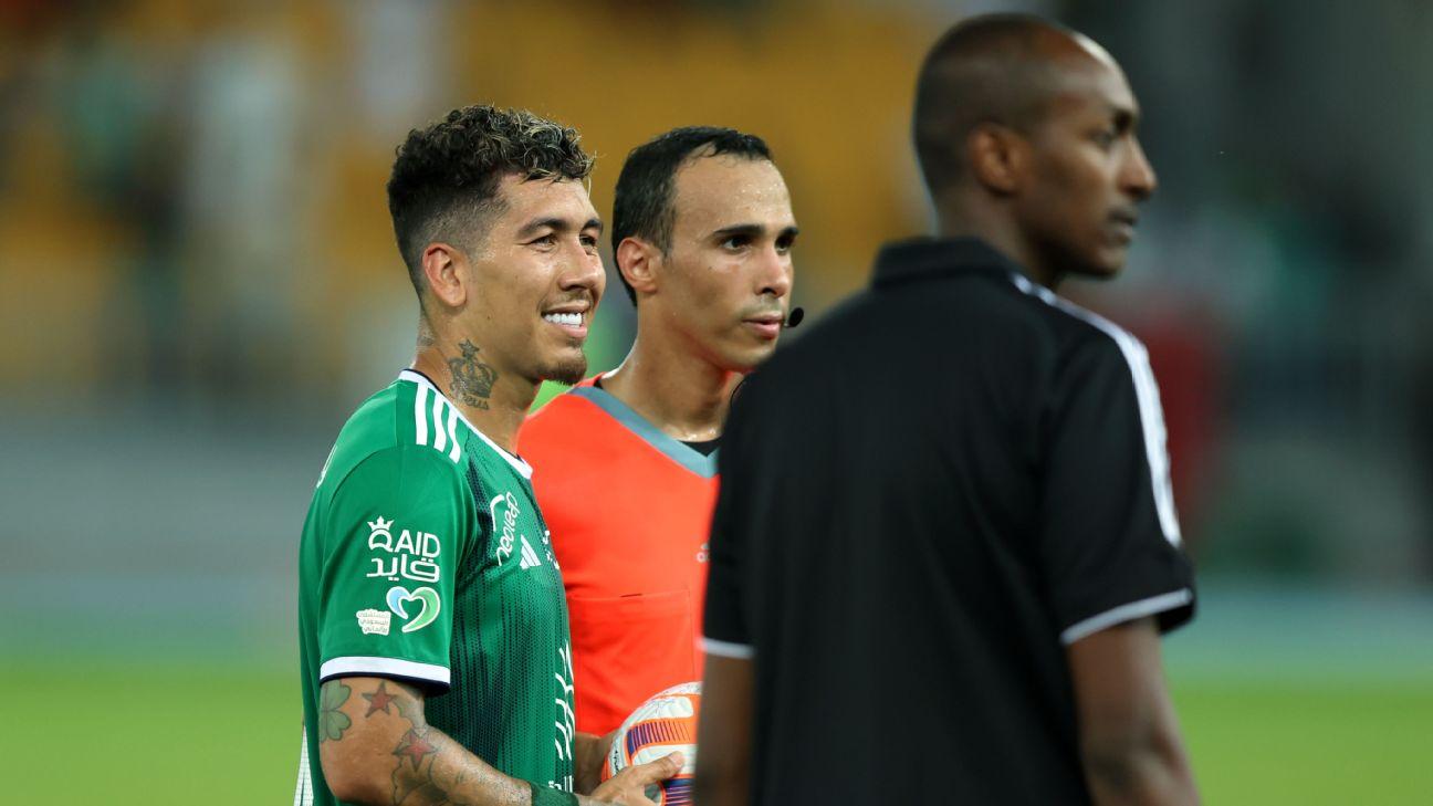Roberto Firmino takes the match ball after scoring a hat trick on his Saudi Pro League debut for Al Ahli.