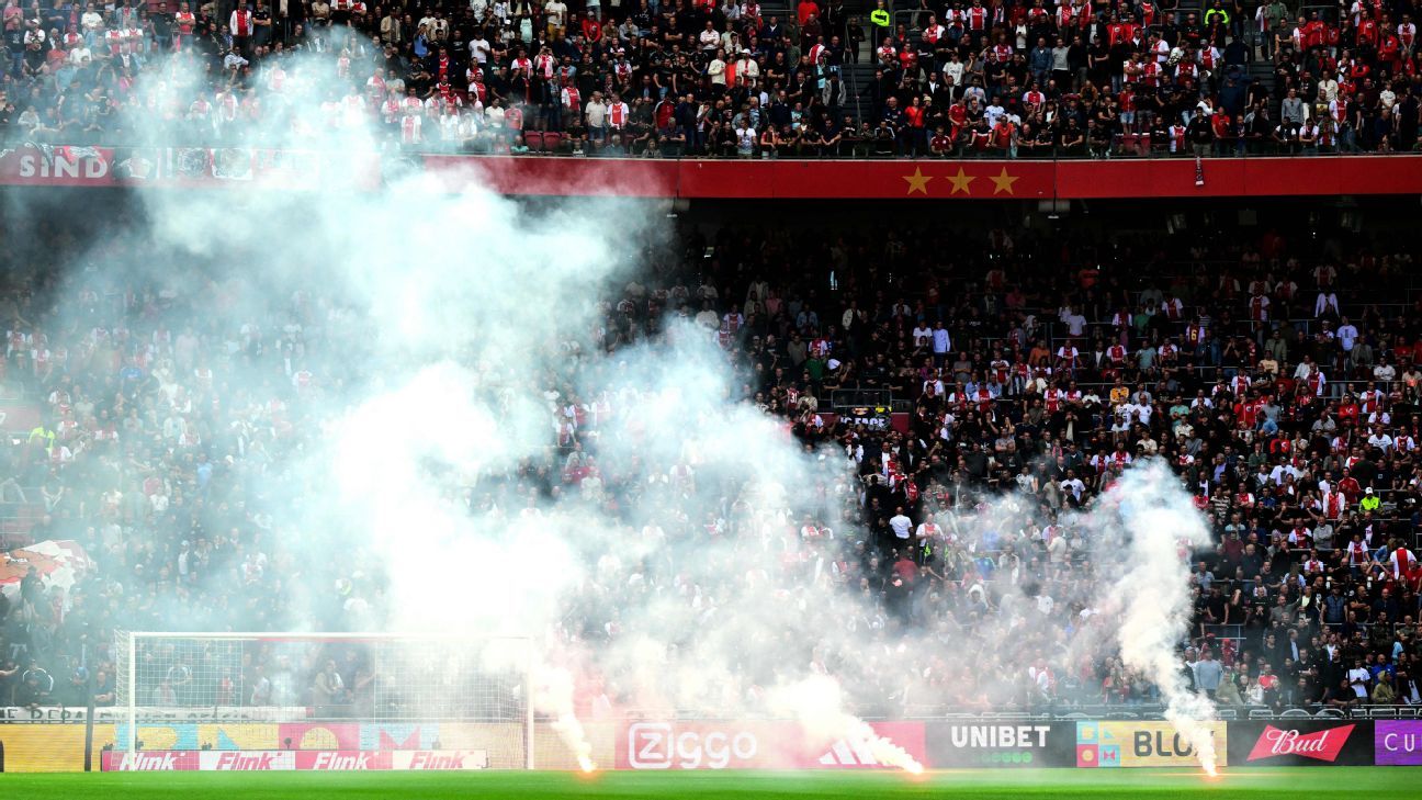 Ajax-Feyenoord abandoned after fans throw flares