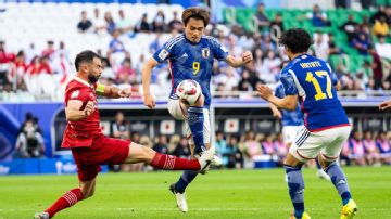 Japan advance at Asian Cup but both they and Indonesia left facing nervous wait