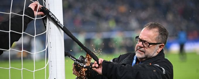 Protesting German fans attach bicycle locks to goal