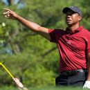 Tiger shares moment with retiring Lundquist