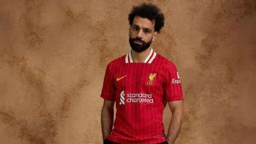 Mohamed Salah models Liverpool's 2024-25 home kit