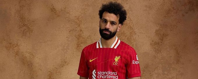 Mohamed Salah models Liverpool's 2024-25 home kit