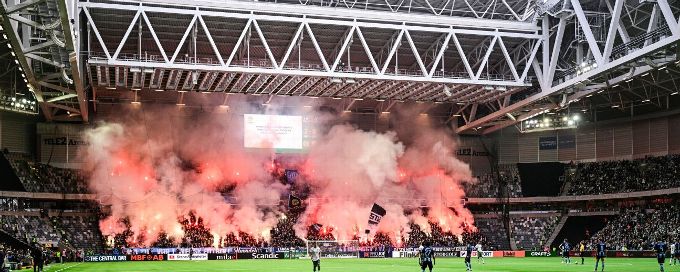 Stockholm derby suspended after fans throw pyrotechnics
