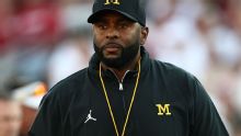 Fired Michigan coach Sherrone Moore in custody; no decision on charges