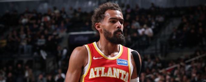 Hawks' Trae Young exits game at Nets with right knee sprain