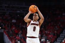 Louisville's Mikel Brown Jr. (back) says he hopes to return for March Madness