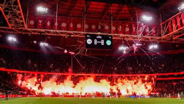 Ajax match abandoned after fireworks, flares set off in stands