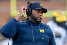 Ex-Michigan coach Moore detained by police after firing
