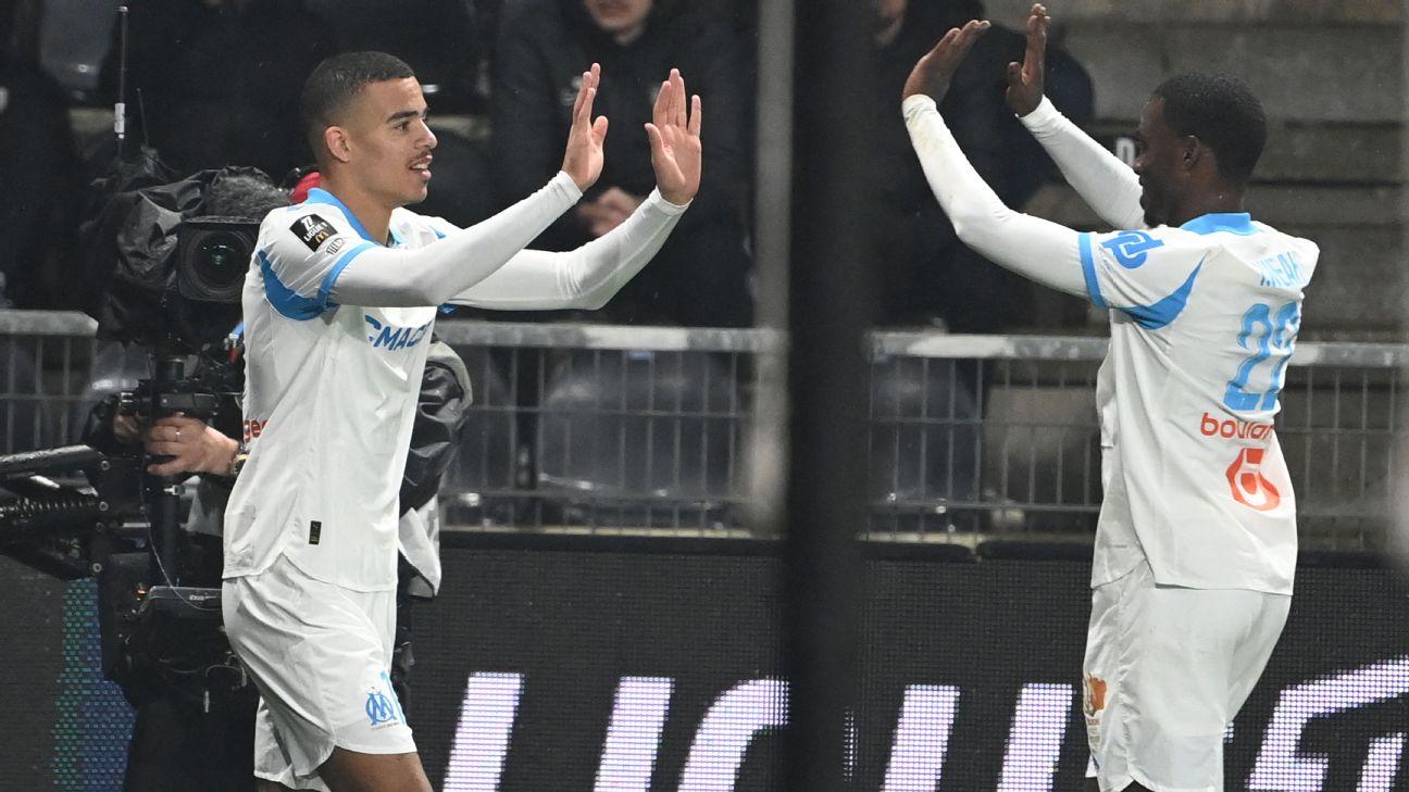 Mason Greenwood (L) celebrates with Timothy Weah after scoring in Marseille's win over Angers.