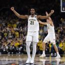 Michigan holds off UConn to win second NCAA hoops title Michigan holds off UConn to win second NCAA hoops title