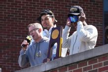 Michigan, May toast title with fans: 'This trophy is yours'