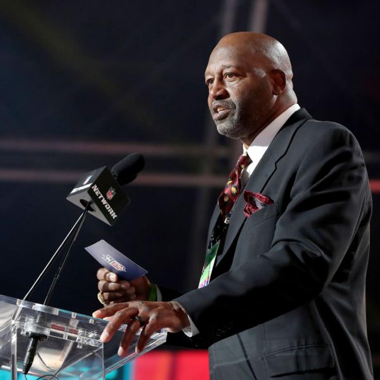 Monte Coleman, pictured here announcing a draft pick for Washington in 2021, played all 16 of his NFL seasons with the team and is a member of its Ring of Honor.