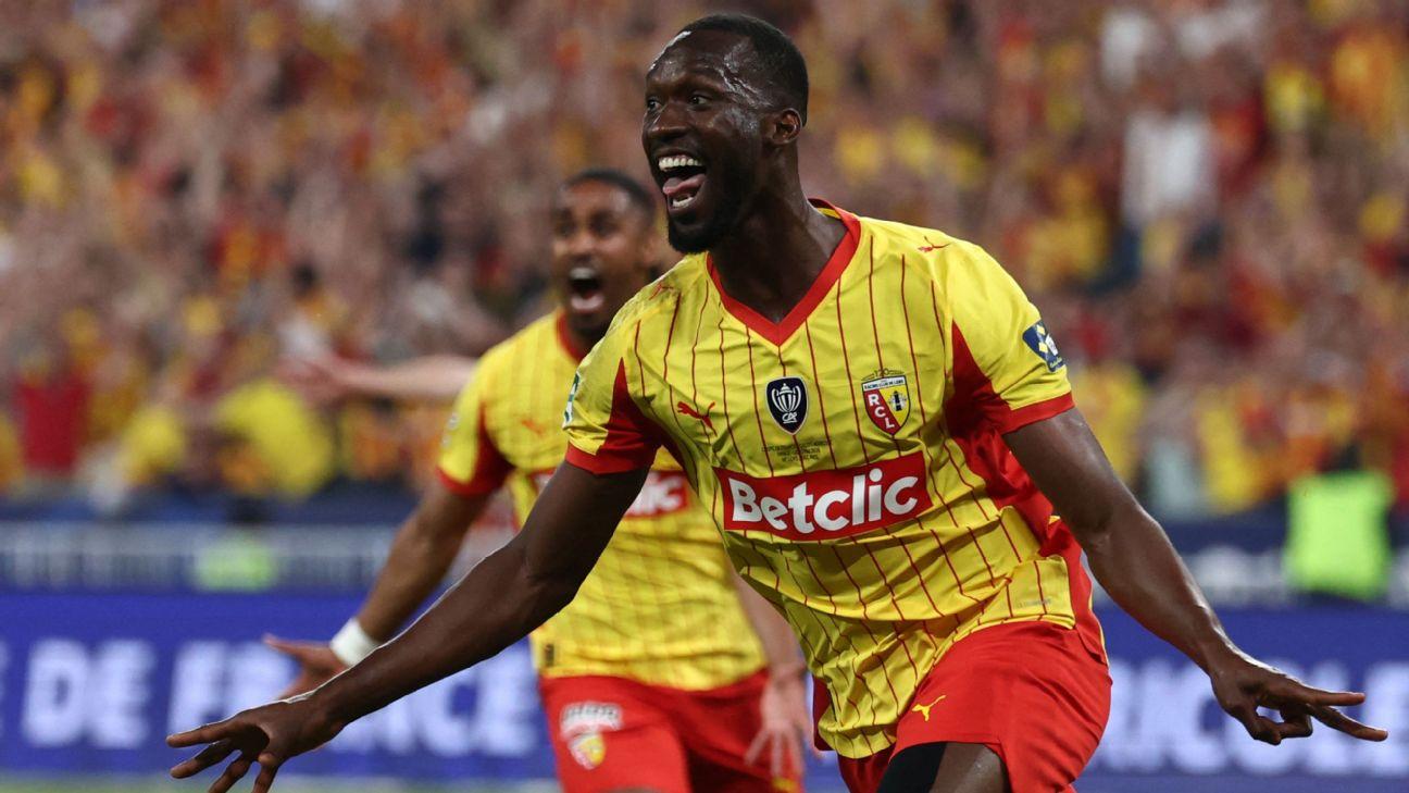 Lens' Senegalese forward Abdallah Sima celebrates scoring his team's third goal during their French Cup final win over Nice.