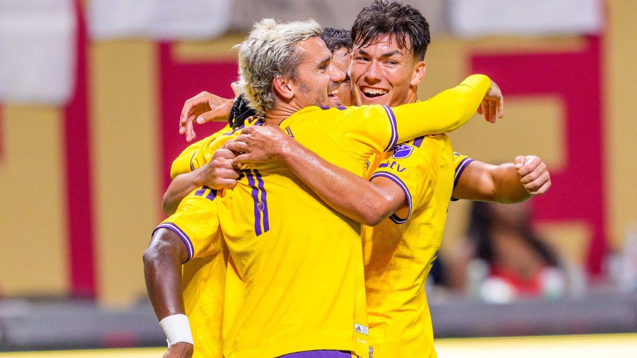 Antoine Griezmann celebrates with Orlando City teammates after scoring a goal against Atlanta United.