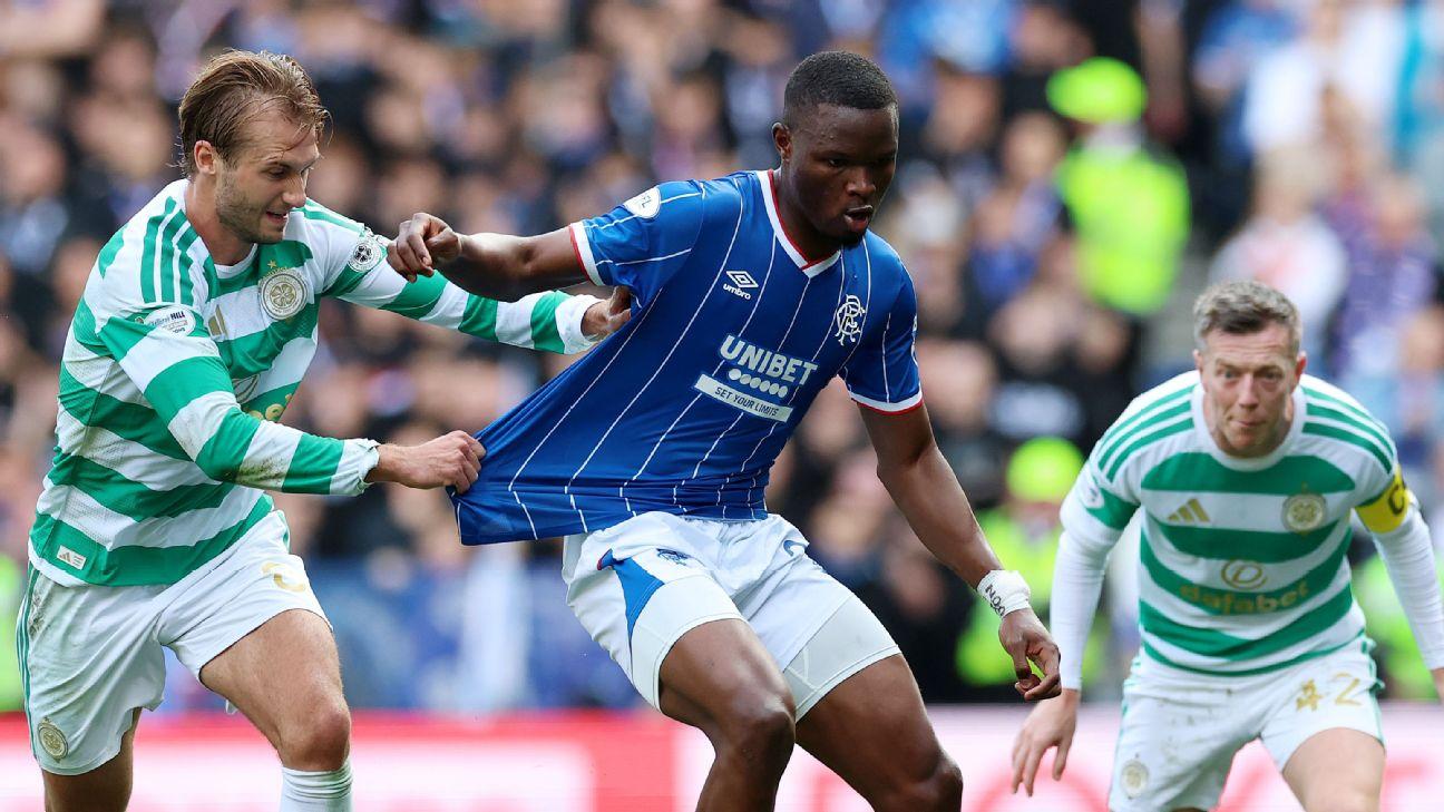 Olwethu Makhanya of Rangers is challenged by Benjamin Nygren of Celtic.