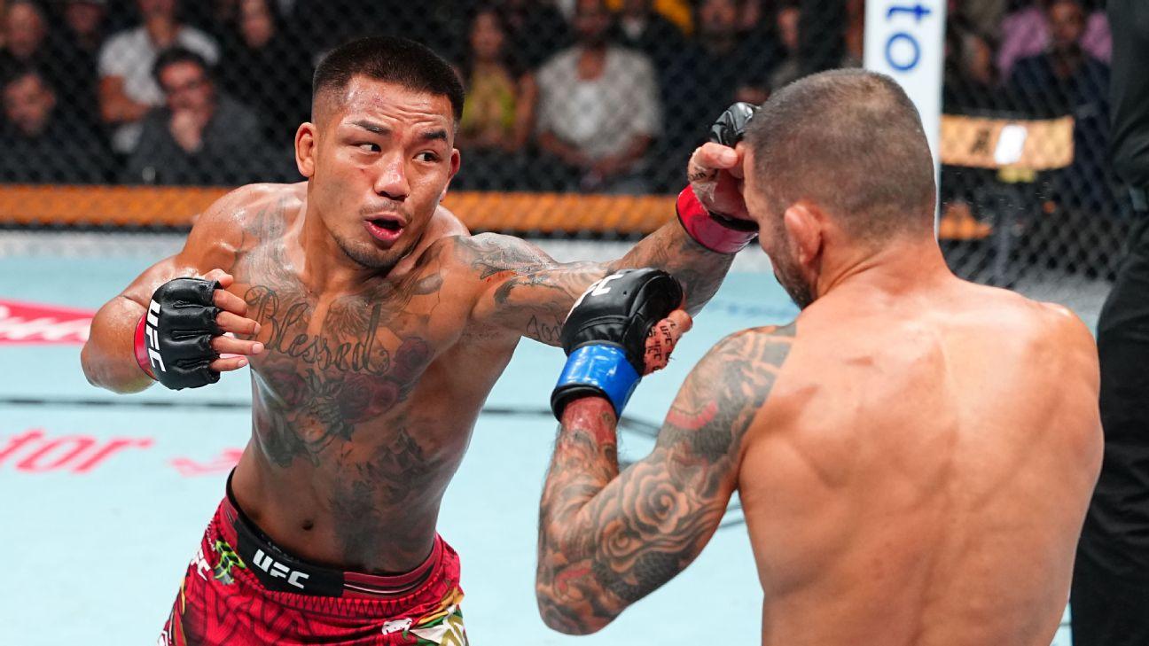 Joshua Van, left, beat Alexandre Pantoja, right, by unanimous decision to retain the UFC men's flyweight championship at UFC 331.