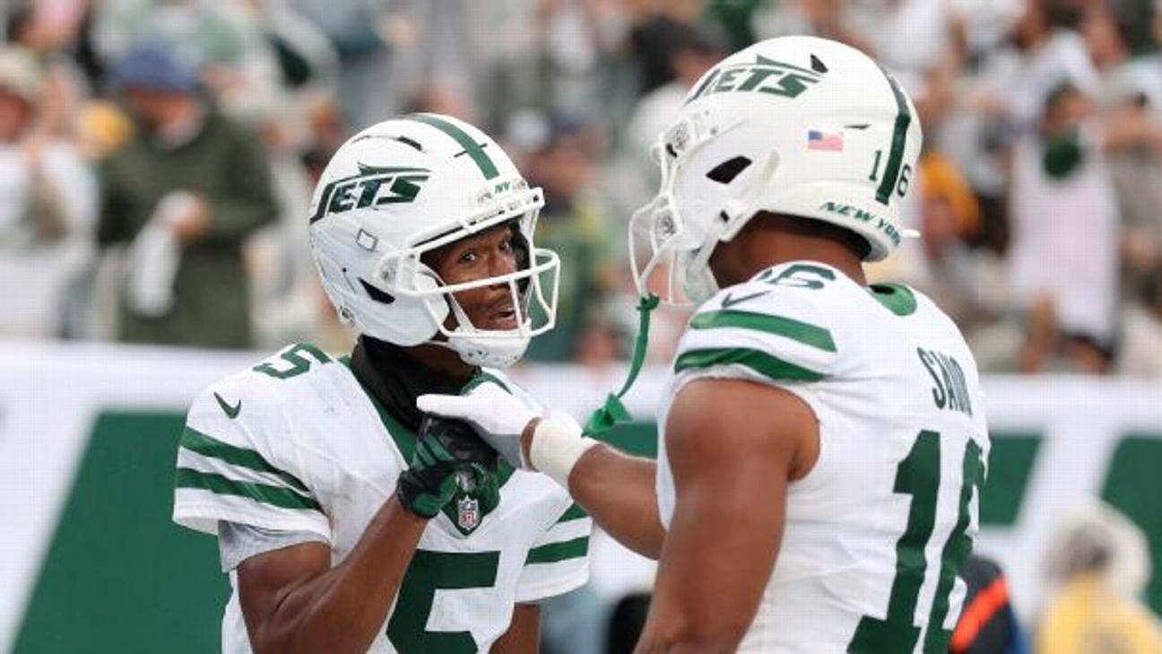 Wide receiver Garrett Wilson celebrates after scoring a touchdown with tight end Kenyon Sadiq.