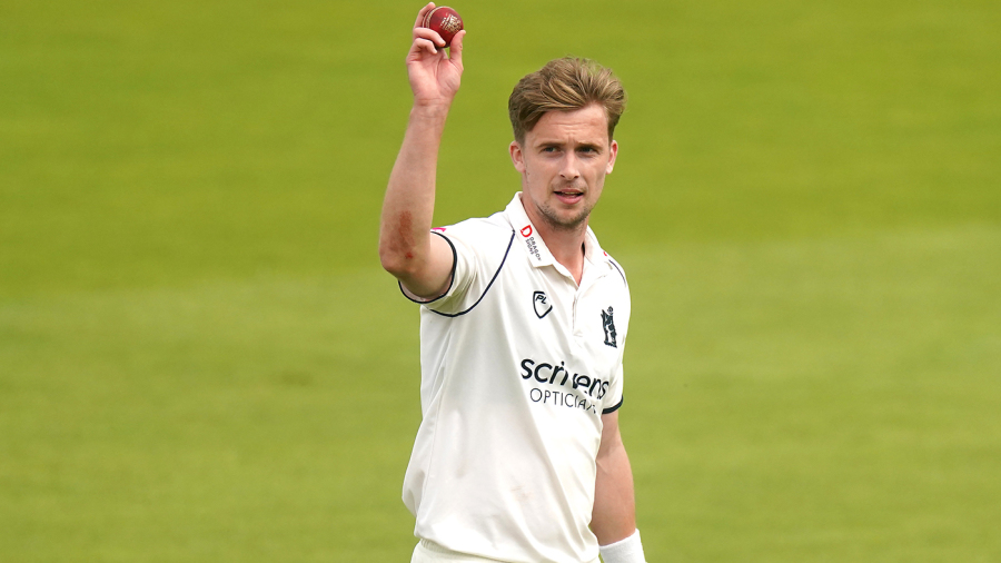 Craig Miles holds the ball aloft for his five-for — Article image accompanying Craig Miles, Gloucestershire seamer, retires aged 32 to prioritise mental health on WagerUp Sports News.
