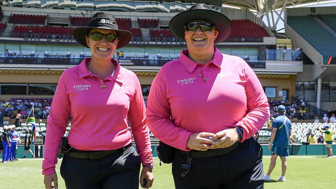 a determined female cricketer in action her eyes fixed on the goalthe intensity of a woman athlete focused on her sporta moment of pure concentration from a dedicated female player
