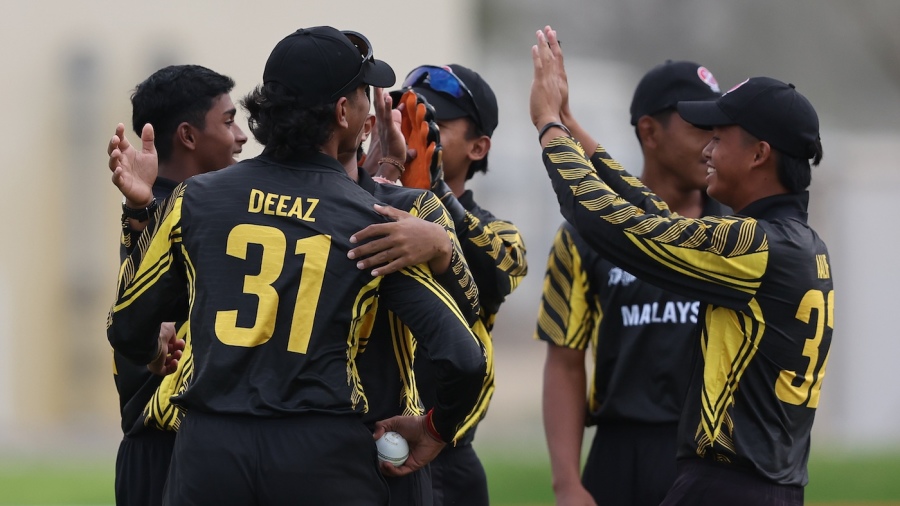 The Malaysia players celebrate a wicket — Article image accompanying Asian Games: Malaysia enter quarter-finals after washout, Oman knocked out on WagerUp Sports News.