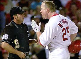 Nov 11, 2001; San Francisco, CA, USA; St. Louis Cardinals first baseman Mark  McGwire pulls off his batting gloves after striking out in the eighth  inning during game against the San Francisco