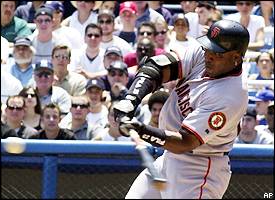 Mar 28, 2002; San Francisco, CA, USA; San Francisco Giants' Barry Bonds,  #25, points to the sky after hitting a homerun in the 4th inning of their  exhibition game against the Oakland