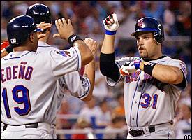 Philadelphia Phillies' Bobby Abreu, center, is congratulated by