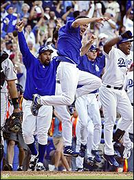 Los Angeles Dodgers Steve Finley hits a double , bringing in three