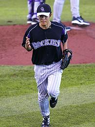 Winning pitcher Byung-Hyun Kim of the Colorado Rockies heads to