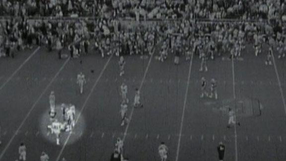 Kenny Mayne of ESPN walks off the field after he hit himself in