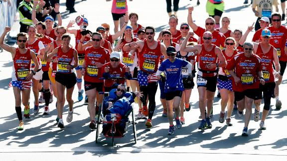 Meb Keflezighi, a Boston Marathon winner, throws out the ceremonial first  pitch before a baseball game between the Boston Red Sox and the Los Angeles  Angels, Friday, April 14, 2023, in Boston. (