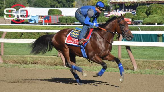 American Pharoah jockey Victor Espinoza throws the first pitch at