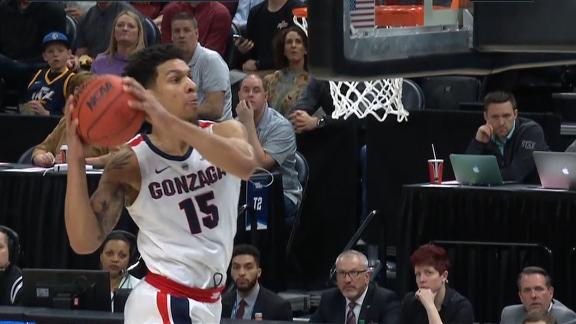 Clarke throws down the two-handed windmill