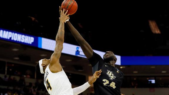 Tacko Fall fights through defenders for and-1 layup