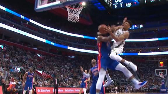 Giannis adjusts in mid-air for and-1 bucket