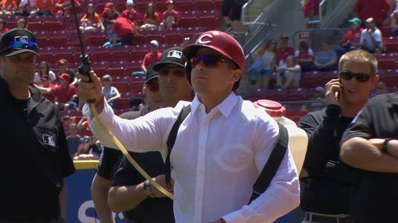 Derek Dietrich 'helps' during bee delay 