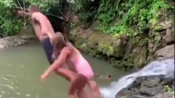 Brady and his daughter jump off a cliff
