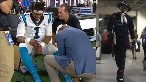 Cam suffers foot injury, leaves stadium in a boot