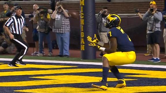 Michigan defensive back Ambry Thomas (1) tries to rip the ball