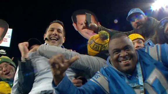 Schefter gets a running start and goes for the Lambeau Leap