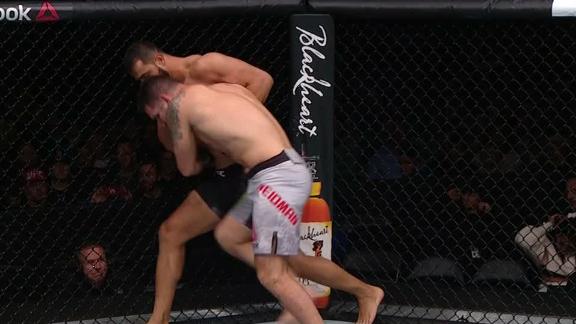 Reyes fights off Weidman's takedown attempt