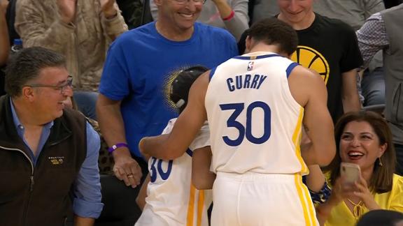 Steph celebrates with young fan after buzzer-beating 3