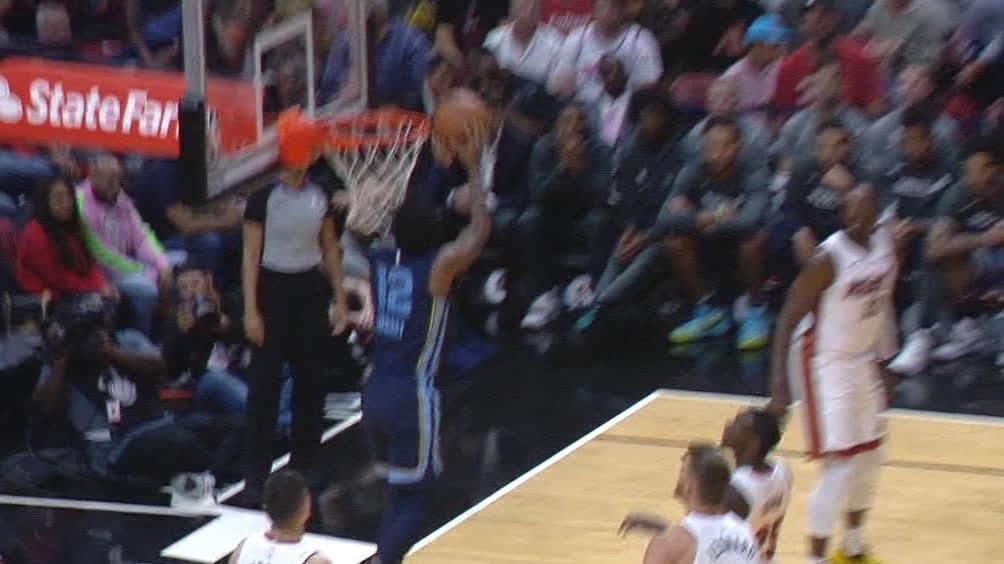 Morant finishes the alley-oop with a layup