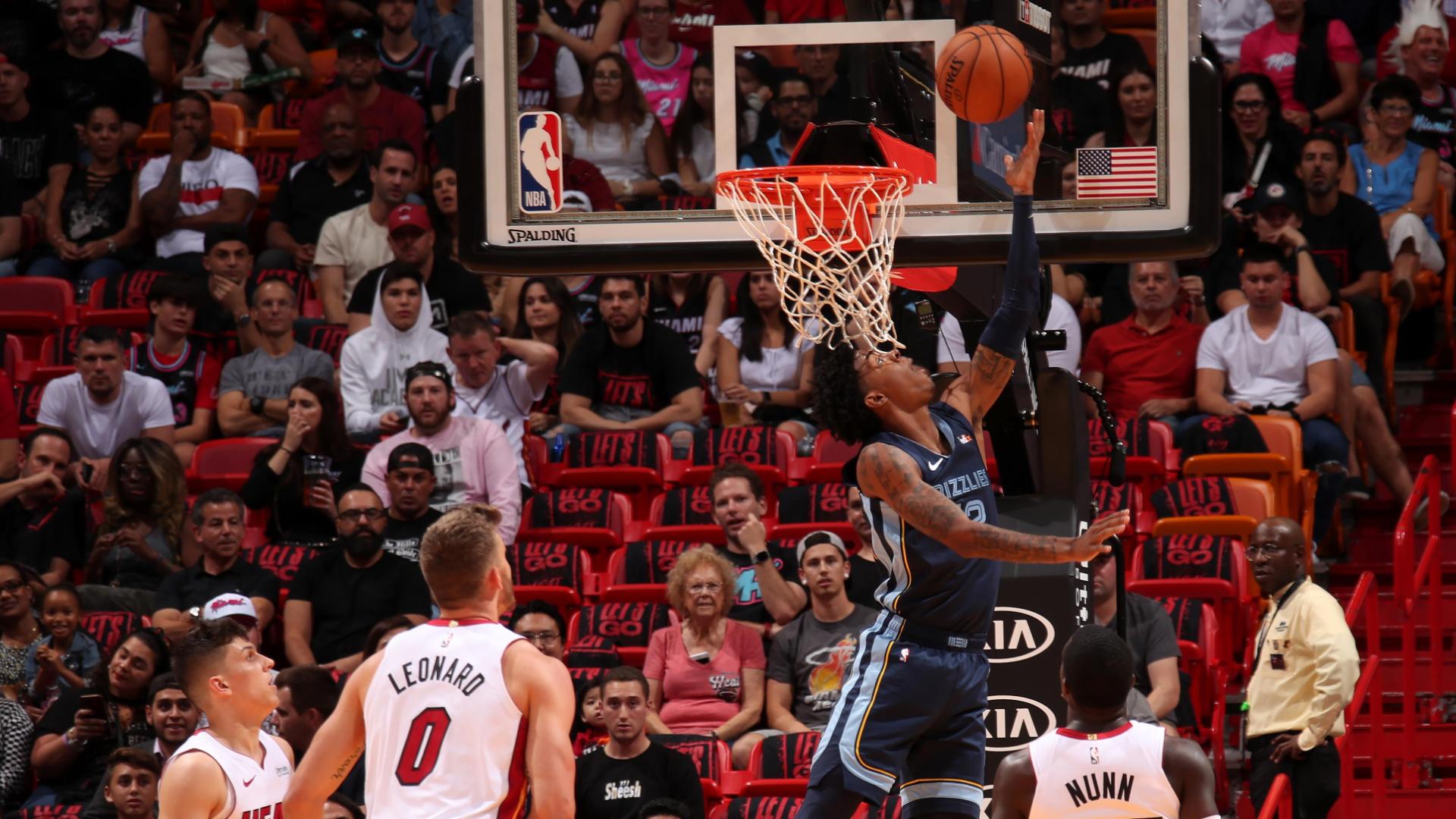 Morant finishes the alley-oop with a layup