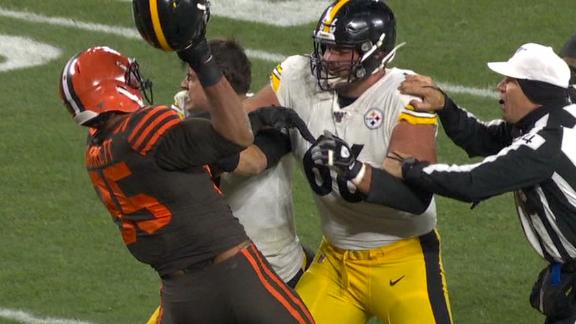 Garrett clubs Rudolph with helmet as fight breaks out