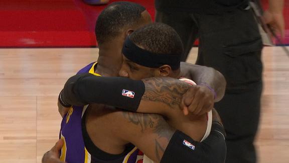 LeBron, Melo embrace at mid-court