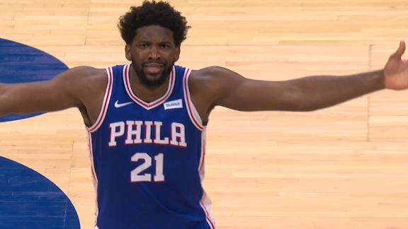 Embiid shimmies after acrobatic and-1