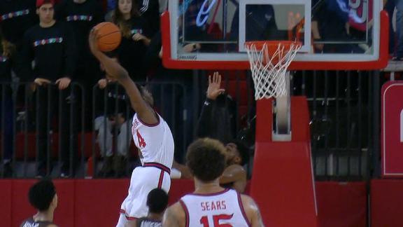 St. John's guard puts a defender on a poster