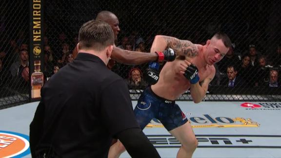 Usman's counterpunch breaks Covington's jaw
